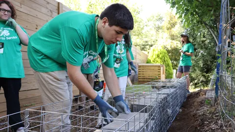4-H members build a backyard retaining wall as part of a hands to service project at 4-H Congress.
