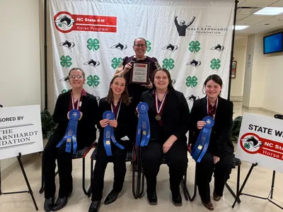 A picture of the first place senior hippology team and their awards