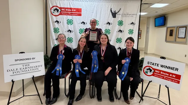 A picture of the first place senior hippology team and their awards