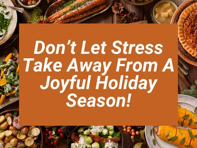 A top-down view of a rustic wooden holiday feast table surrounded by various dishes with a large orange rectangle overlaid in the center containing the white italic text: "Don’t Let Stress Take Away From A Joyful Holiday Season!"