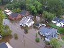Aerial view of brown floodwater covering Queen Street and surrounding homes and St. Thomas Episcopal Church in Windsor NC after Hurricane Matthew.
