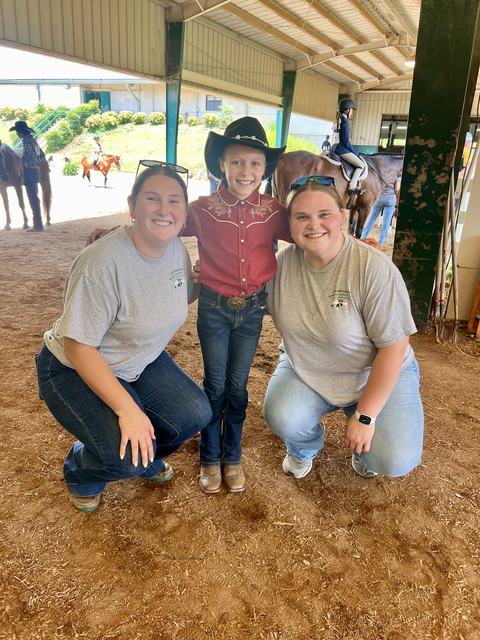 4-H Agent, Summer Intern, and 4-H member at the State 4-H Horse Show