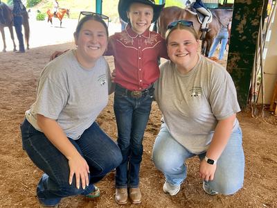 4-H Agent, Summer Intern, and 4-H member at the State 4-H Horse Show