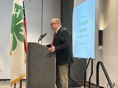 Extension Director, David Monks, stands at a podium while speaking to attendees of the 2026 Southern Region Biennial 4-H Conference.