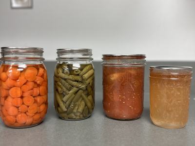 Picture of canned vegetables and jams (Carrots, Green Beans, Tomatoes, Pear Jam)
