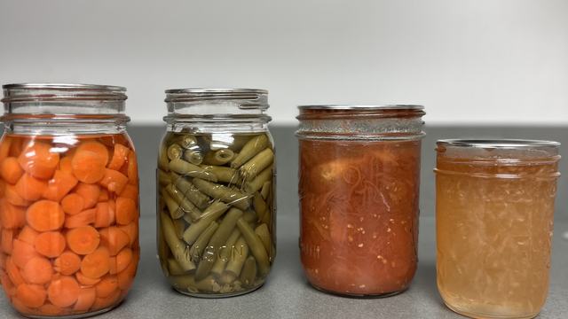 Picture of canned vegetables and jams (Carrots, Green Beans, Tomatoes, Pear Jam)
