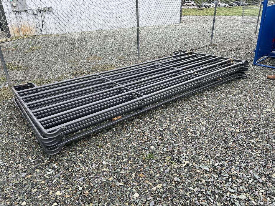 Stack of grey panels laying on the ground.