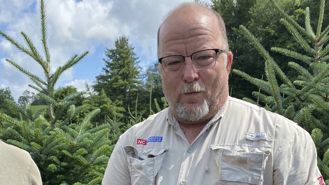 Jerry Moody holds Fraser fir branch