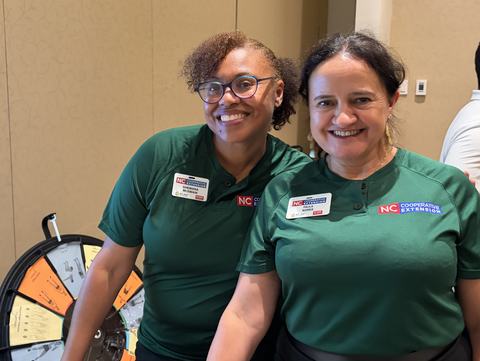 Paula and Shewana wearing green extension shirts