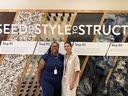 Two people stand in front of a textile recycling display featuring cotton, thread and denim.