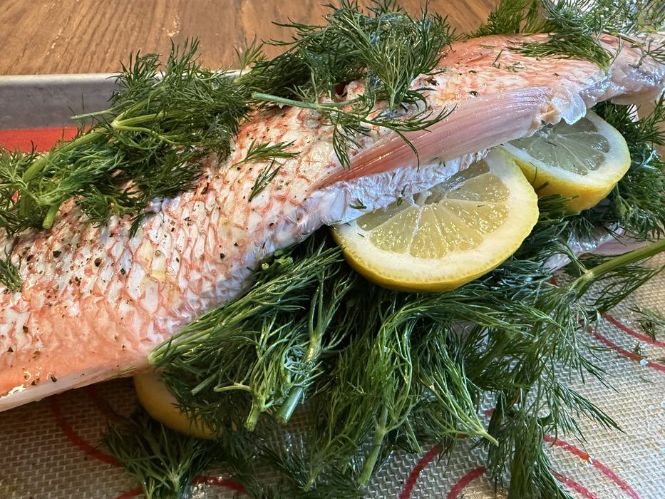 Snapper stuffed with herbs and lemons