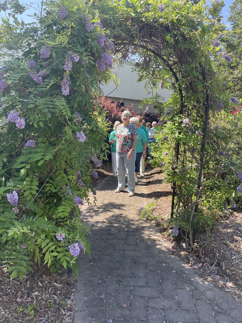A Wilson County Master Gardener volunteer leads a tour group through the gardens.