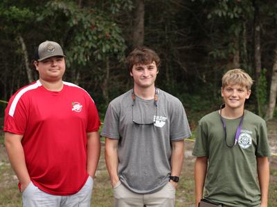Hyde County 4-H State Shooting Sports Team Photo. Three 4-H'ers.