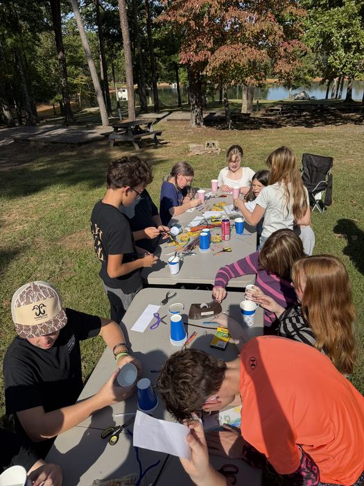 6th Grade Students making bird feeders