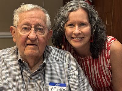 Dr. Bill Collins and Kim LeQuire get their picture taken at the Wolfpack Harvest Dinner