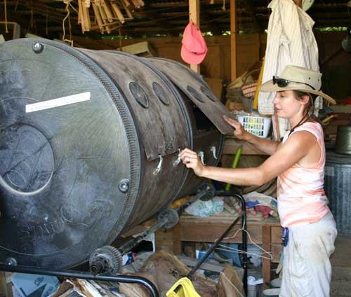 Chris with soil mix compost tumbler