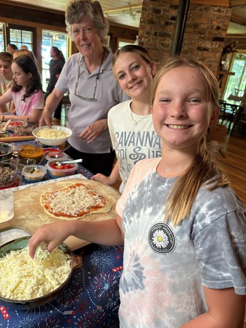Adding pizza toppings at Pizza Camp