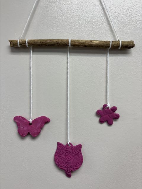 Wall hanging of hand-made air-dry clay charms