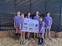 Pamlico County 4-H Dairy Project participants hold a sponsor appreciation banner recognizing supporters of the 2026 Craven/Pamlico Dairy Project.