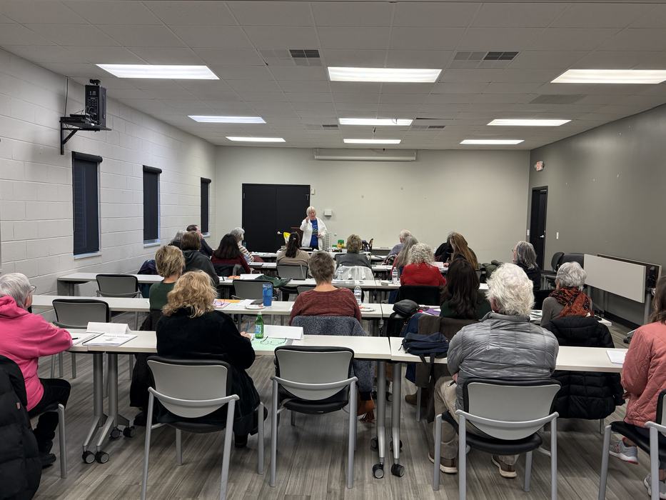 Instructor teaching a Seed to Supper gardening lesson to participants seated in a classroom at the Clay County Center.