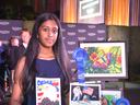Akshita holding her artwork