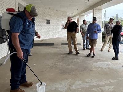 pesticide class attendees watching a demonstration