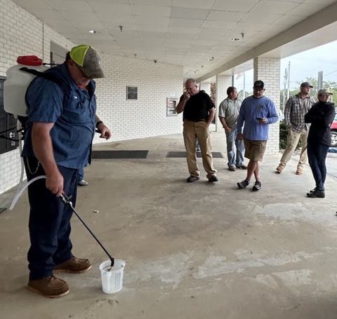 pesticide class attendees watching a demonstration