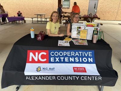 master gardener volunteers attending a festival to promote NC Cooperative Extension