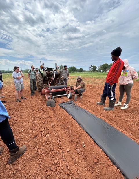 attendees in a training out in the field