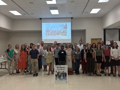 Youth participants and volunteers after the Real Money. Real World. financial simulation.