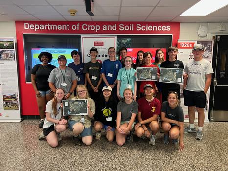 RCW students holding conservation plans