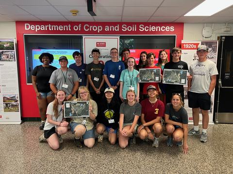 RCW students holding conservation plans