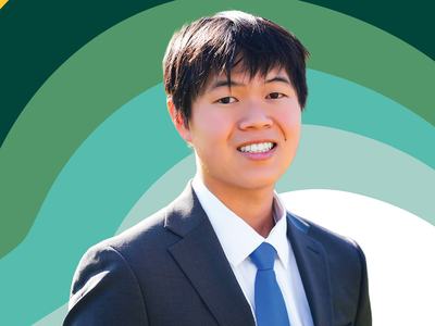 Jonas Pak-Lin smiles at the camera in a dark suit, white dress shirt and bright blue tie, set against a layered green, teal, white and yellow graphic background.