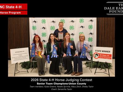 A picture of the members of the winning Senior division team from Union county in front of the NC 4-H horse program picture backdrop.