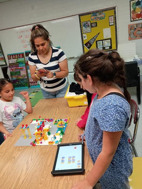 Children participating in a lego robotics program