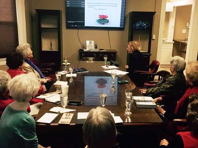 EMG volunteer presenting to room full of people