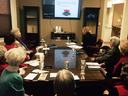 EMG volunteer presenting to room full of people
