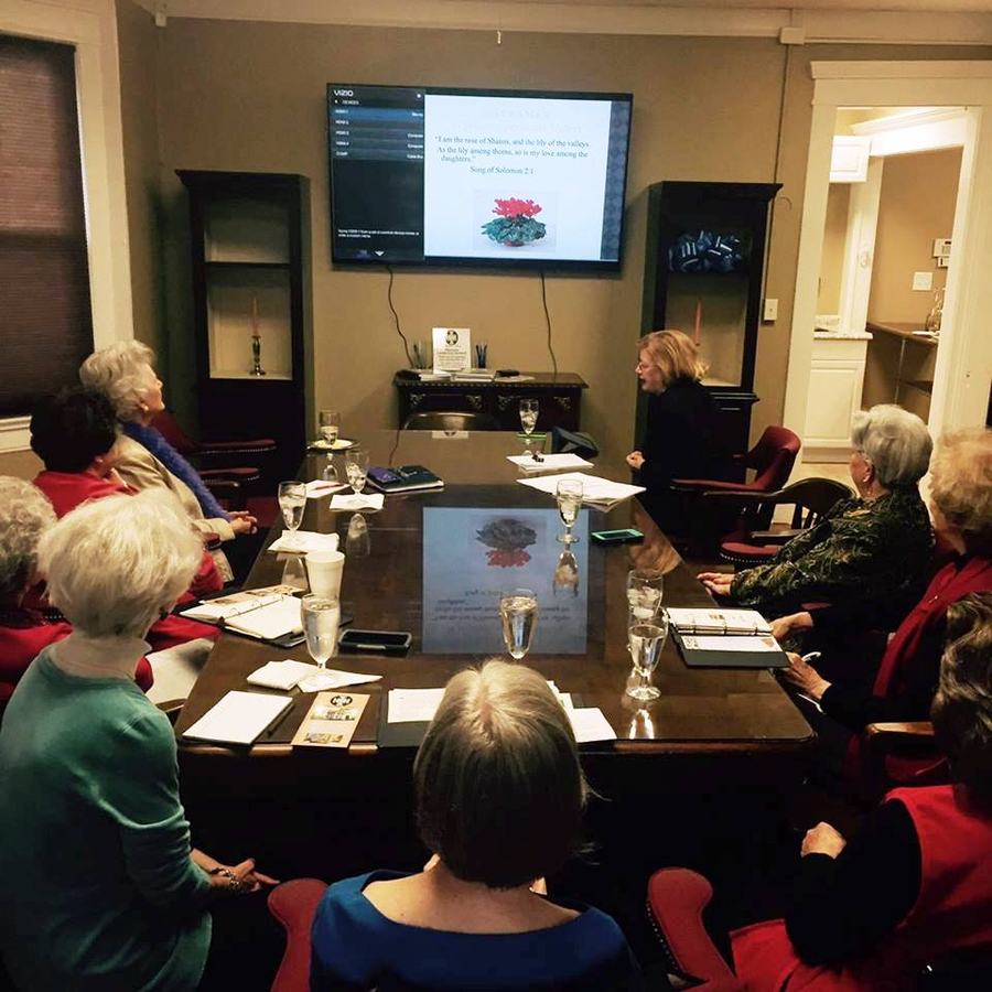 EMG volunteer presenting to room full of people