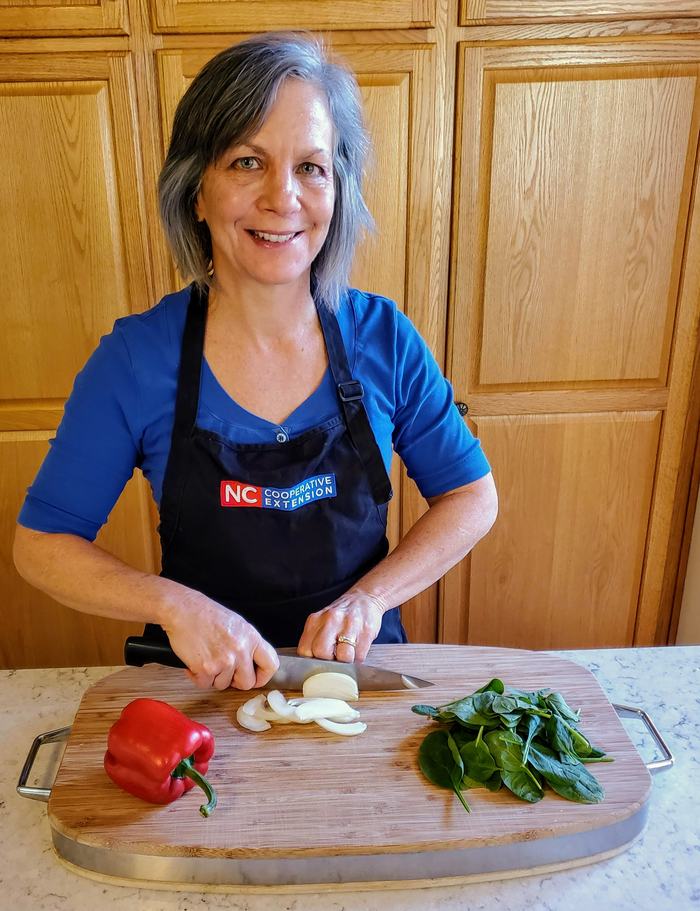 Margie Mansure cuts veggies