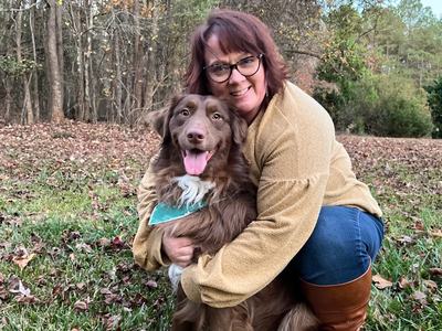 Image of Valery Miller and her dog.