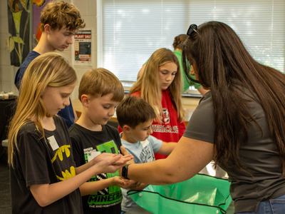 Youth learning how to sow seeds