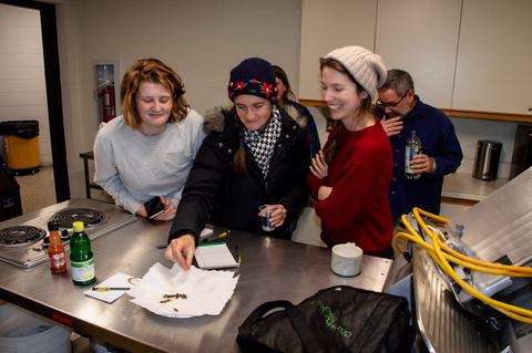 People eating corn earworm caterpillars