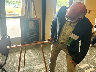Person looking at award plaque