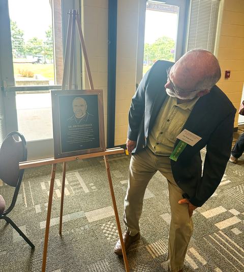 Person looking at award plaque