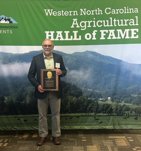 Jim Walgenbach with Ag Hall of Fame plaque