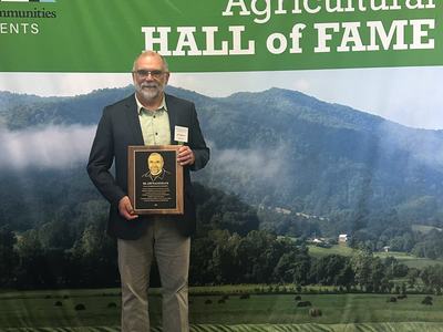 Jim Walgenbach with Ag Hall of Fame plaque