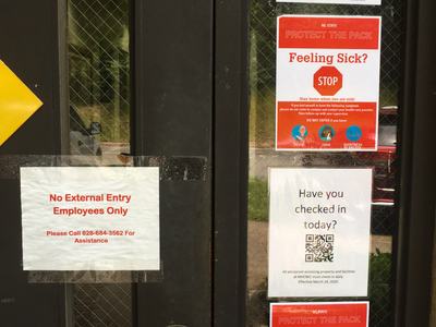 Signs on door of building