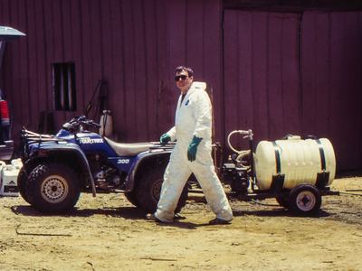 Man spraying with ATV