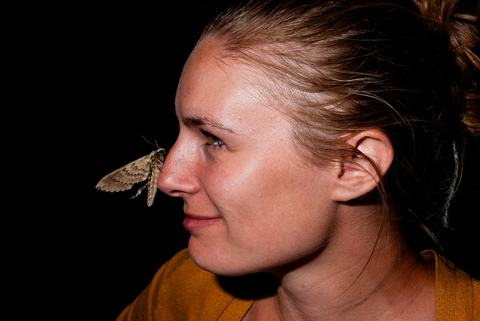Person with moth on nose