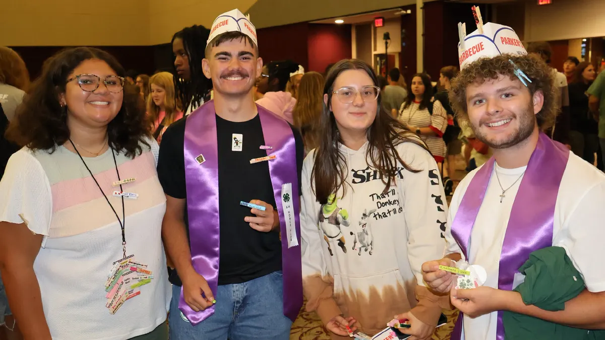 4-H members chat and exchange friendship pins during a networking activity at the 4-H Congress.